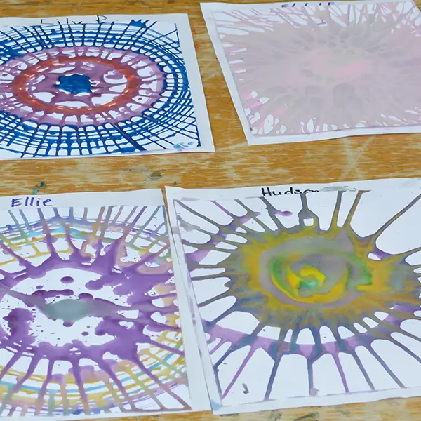 Spin art drying on a table
